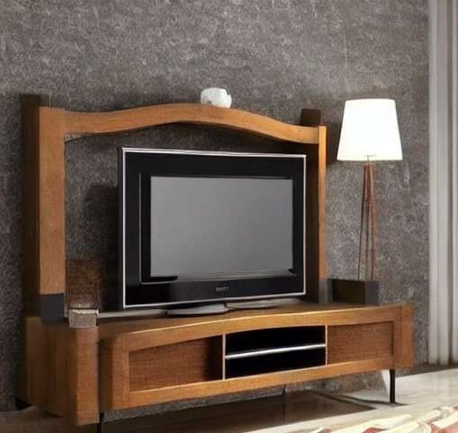 An arched tv unit design with wooden cabinetry and panels