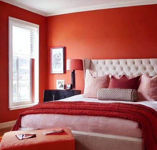 Peach and red colour combinationbedroom with peach walls